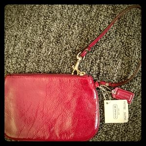 Magenta coach wristlet